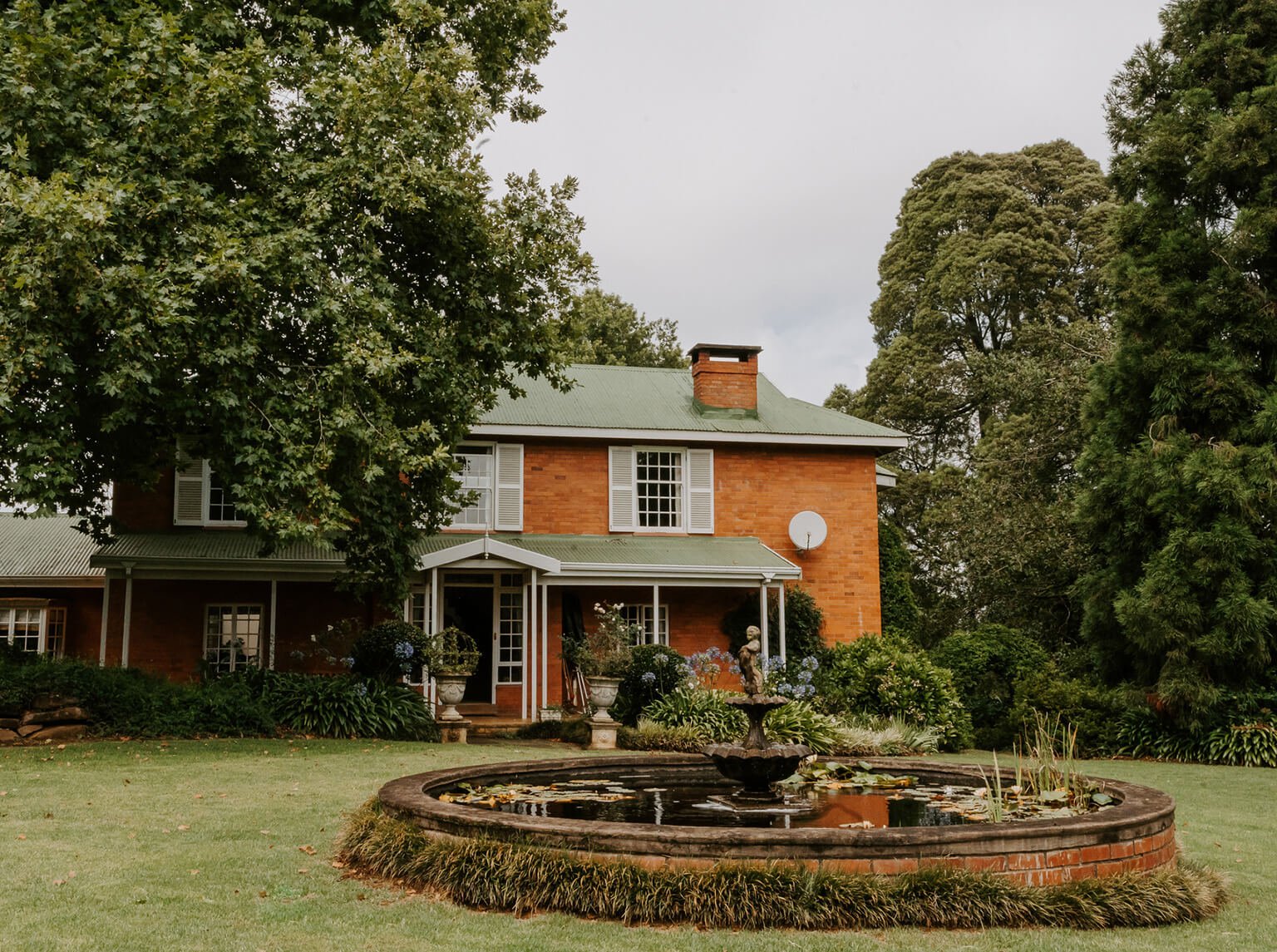 The manor house at Providence, fountain in the foreground